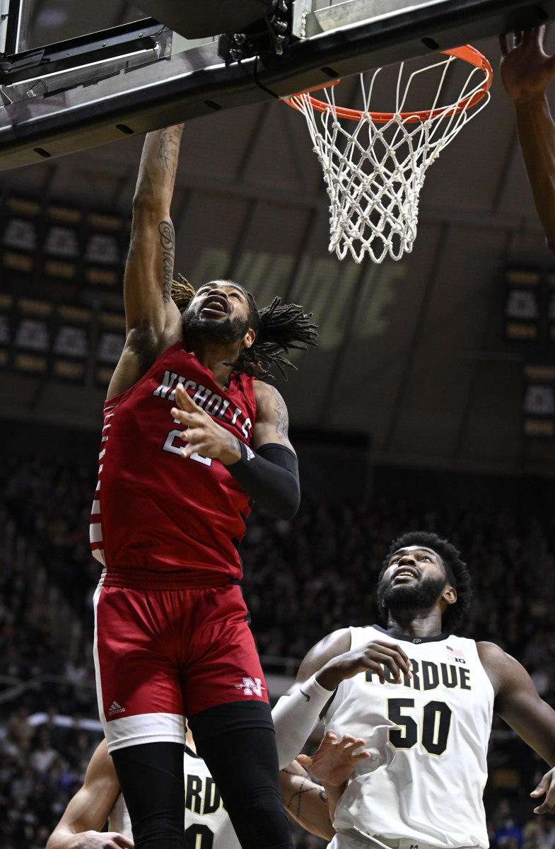 A Nicholls State player goes up for the layup in front of Trevion Williams.